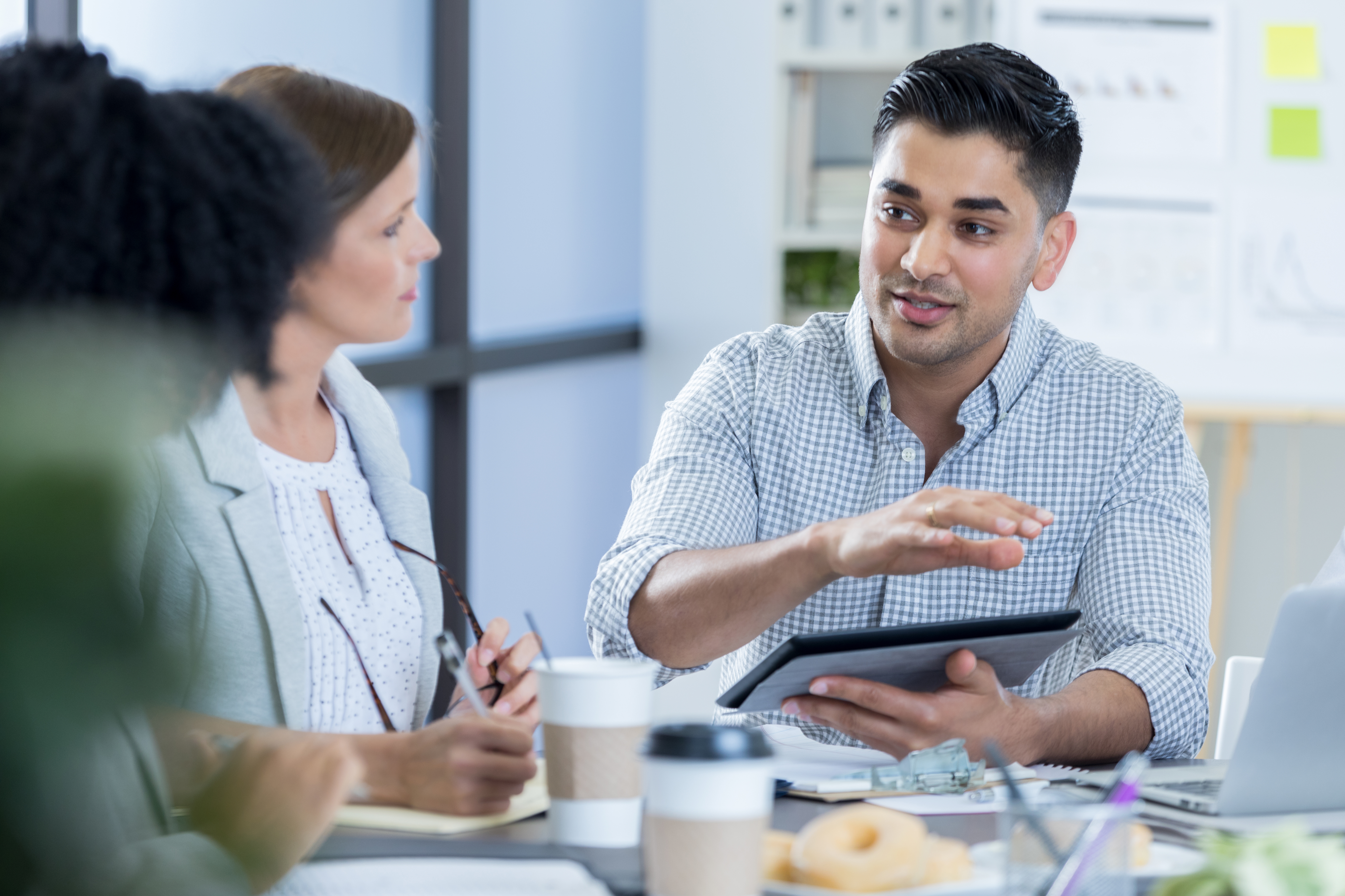 A meeting between three people