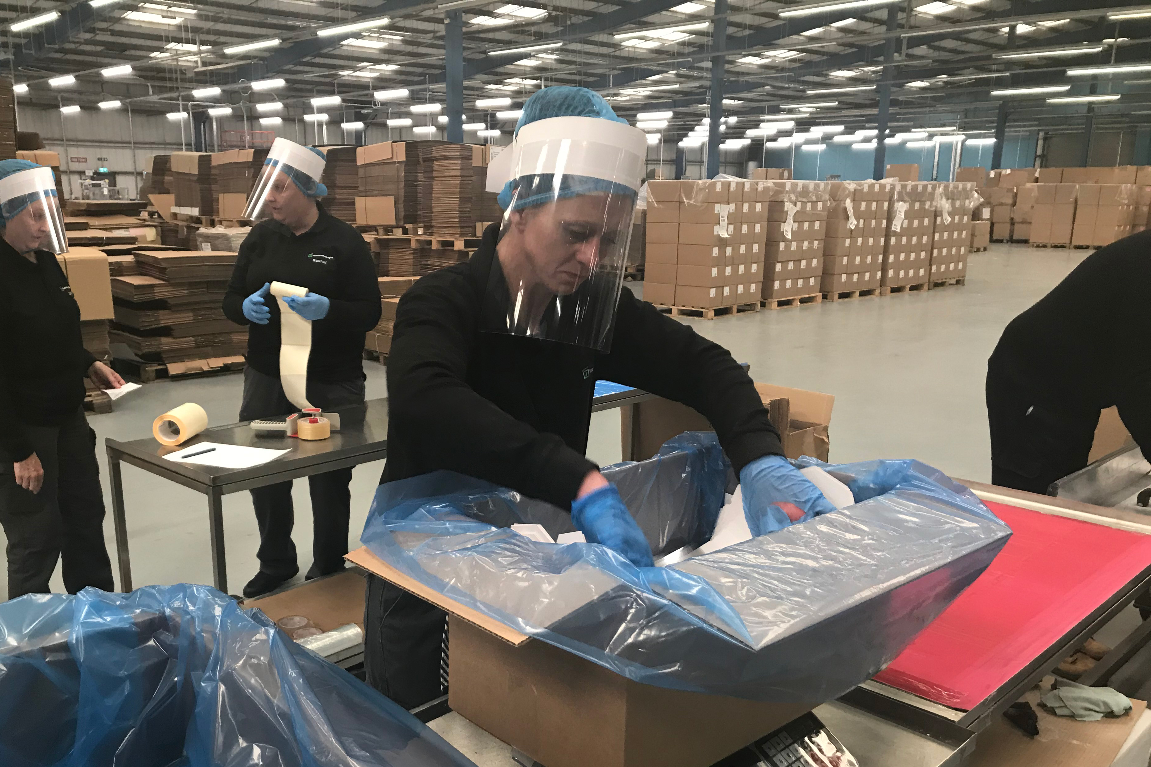 Woman in face visor with box