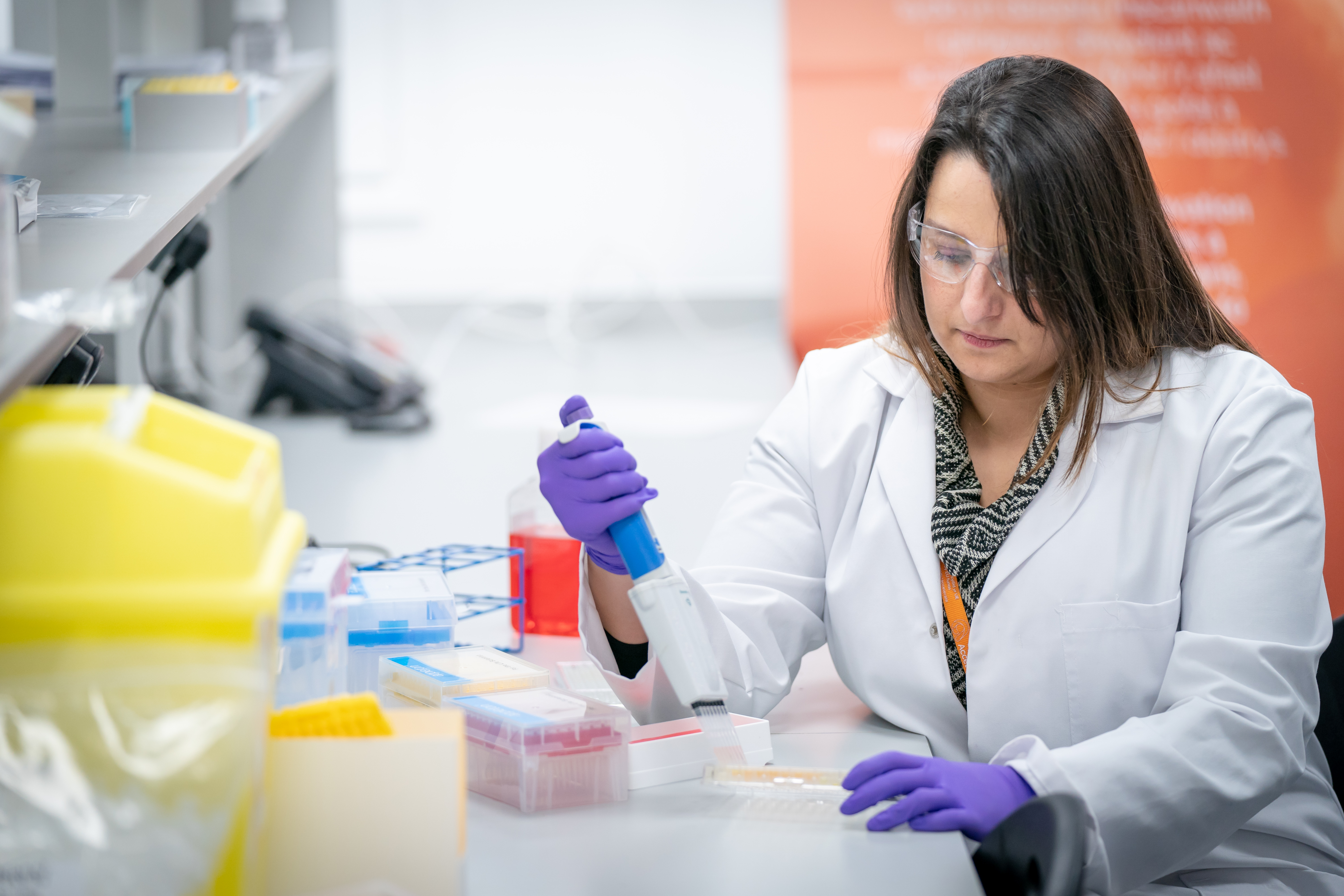 A dr using equipment at HTCs lab