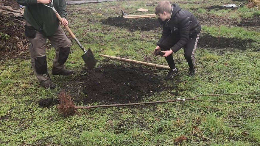 a photo of people digging