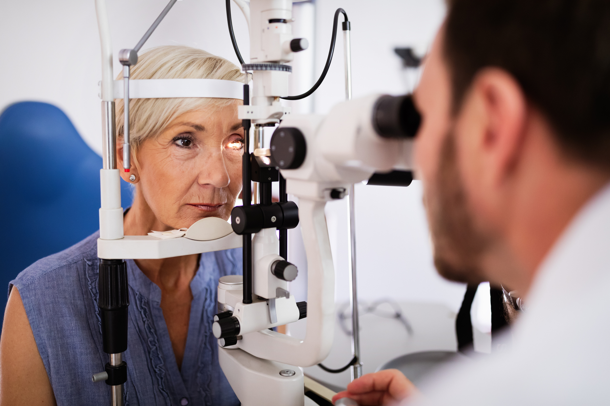 female in optometrists chair