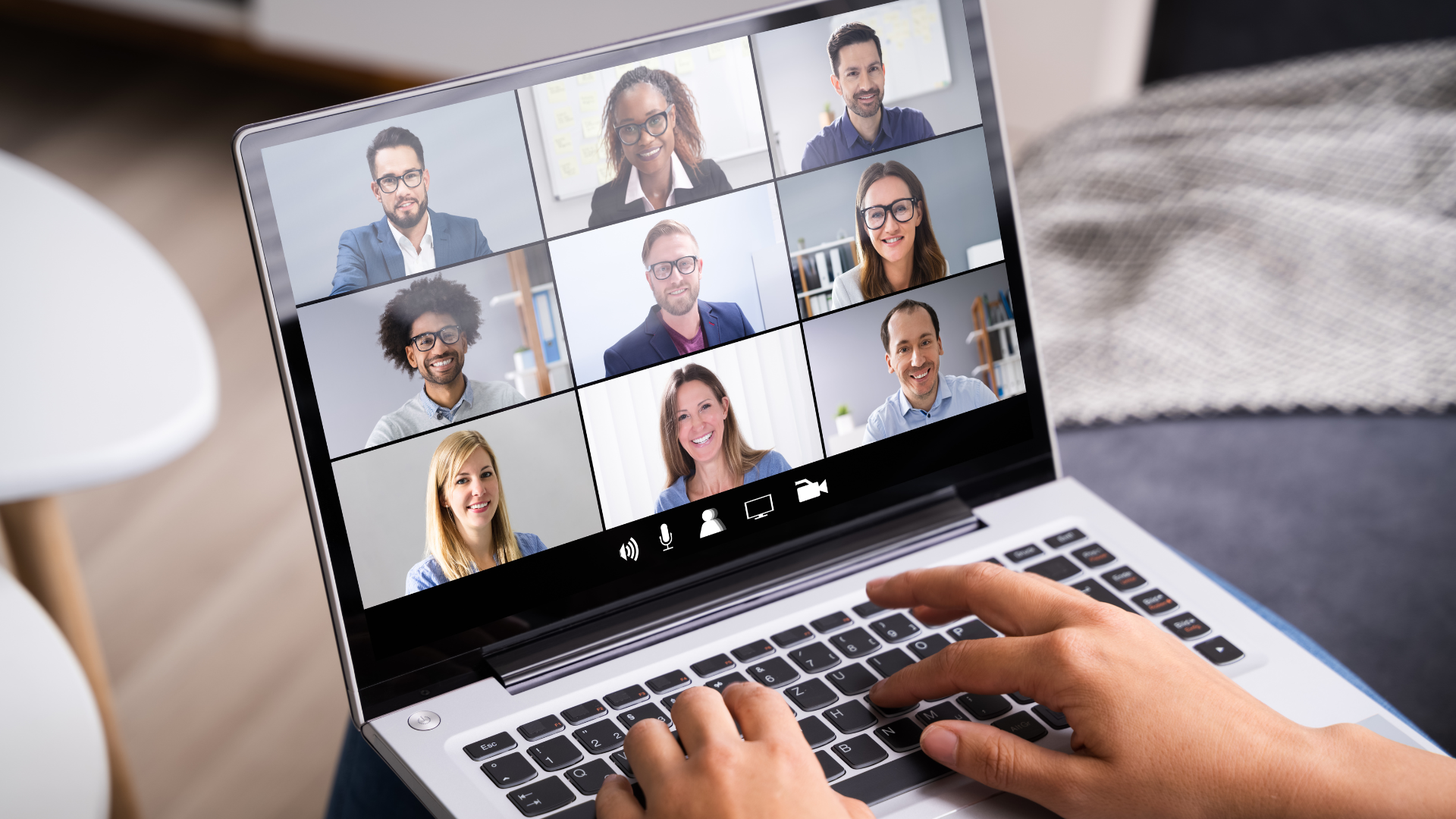 Laptop screen with video call screen on it. 