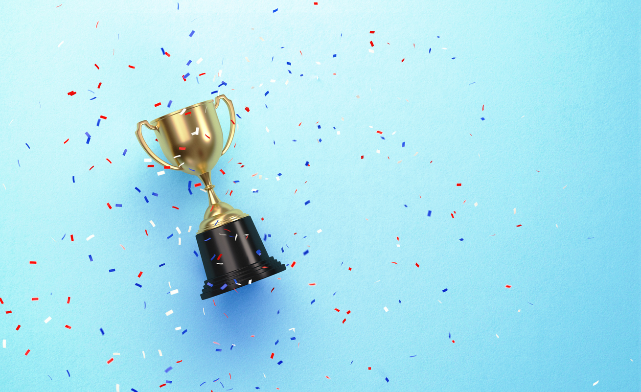 A small gold trophy on a blue background