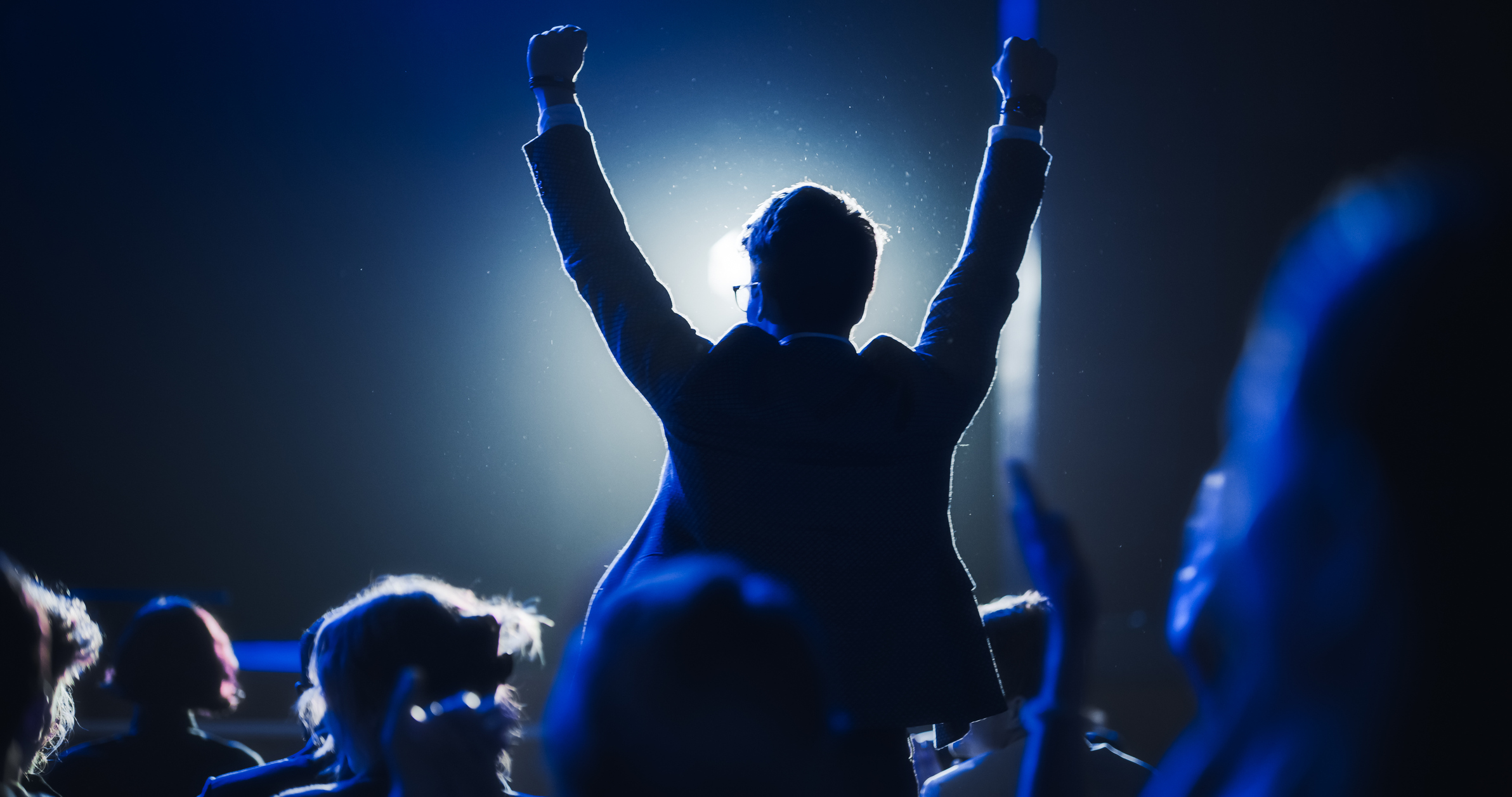 A young man celebrating winning an award