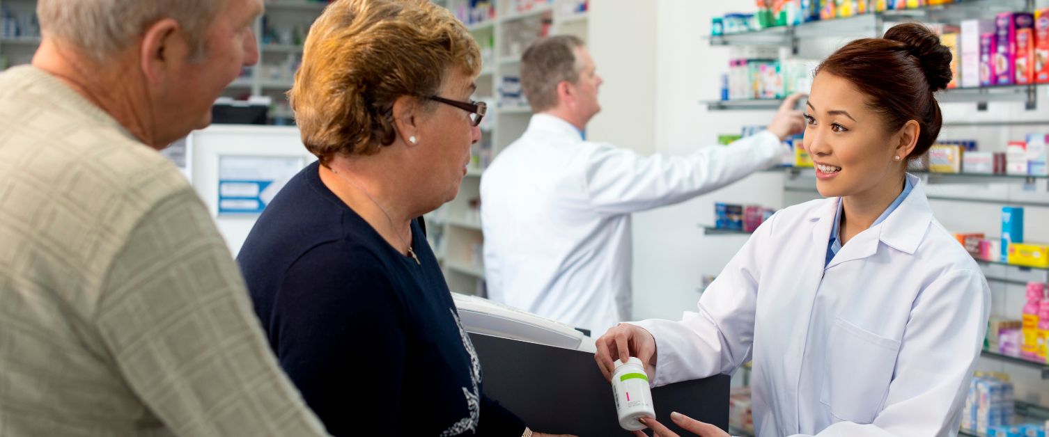 Two people speaking to a pharmaceutical consultant