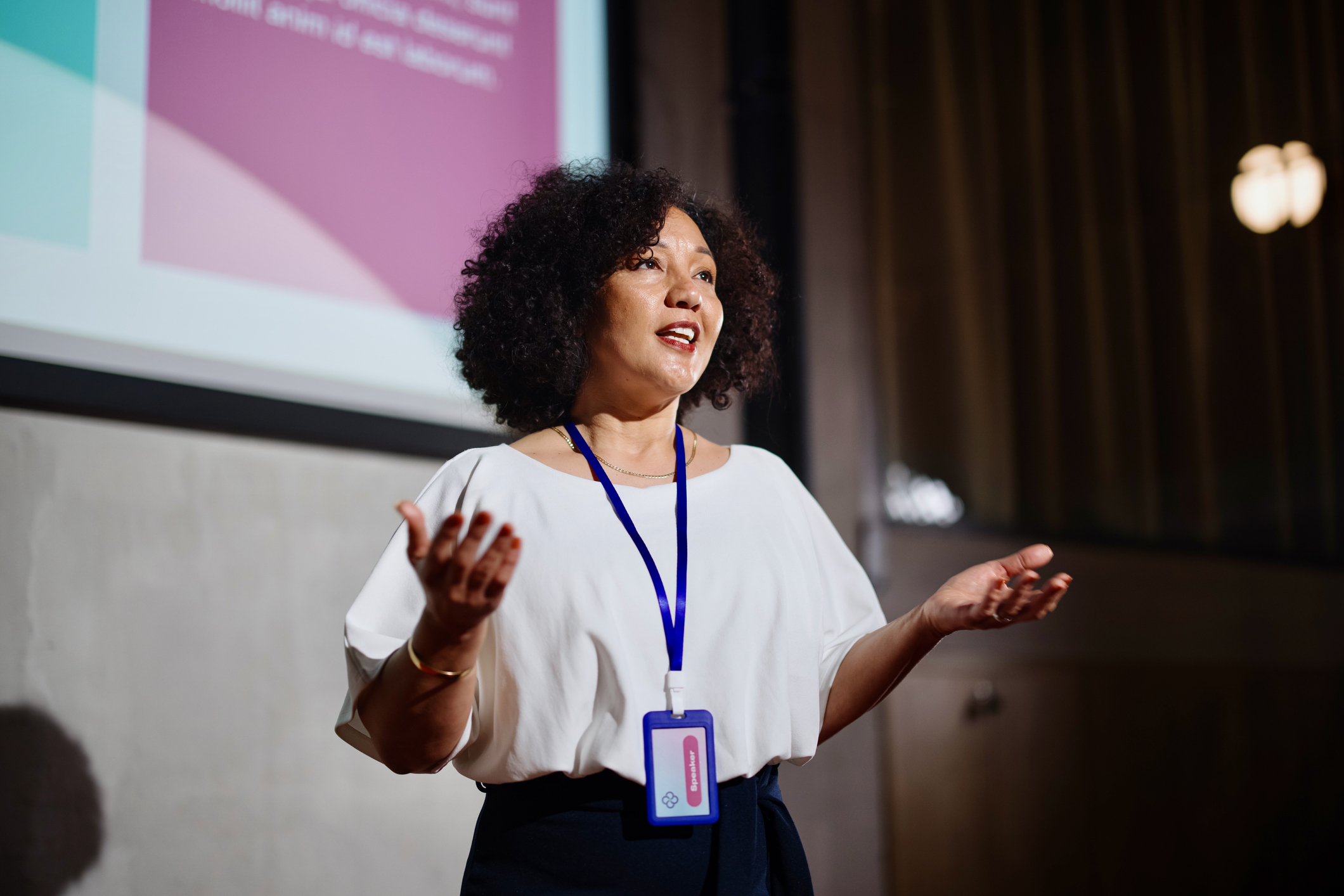 A woman speaking at a conference