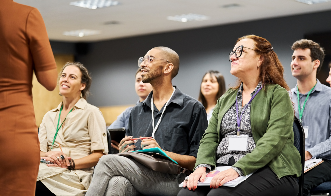 A small group of people listening to a lecture