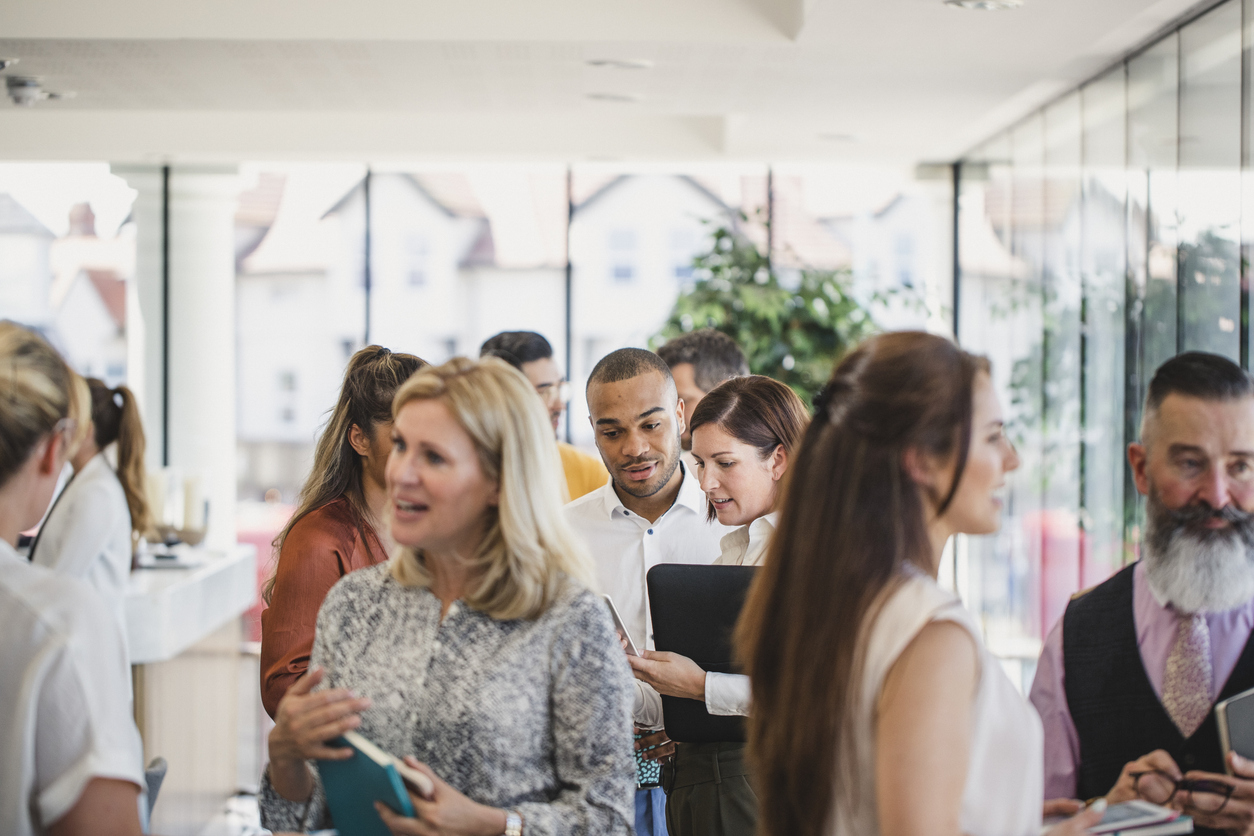 A group of people networking at an event