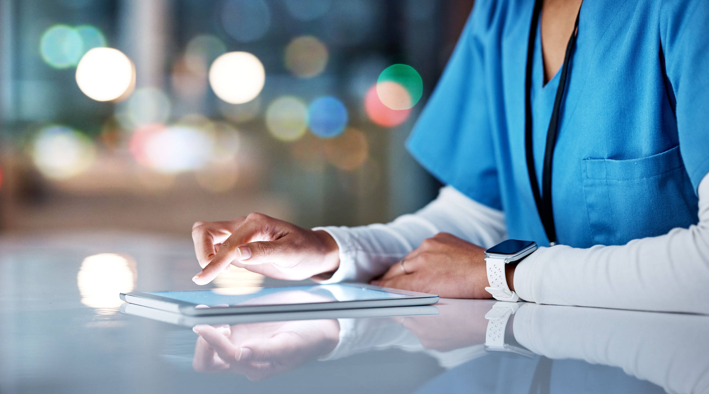 A doctor using an iPad