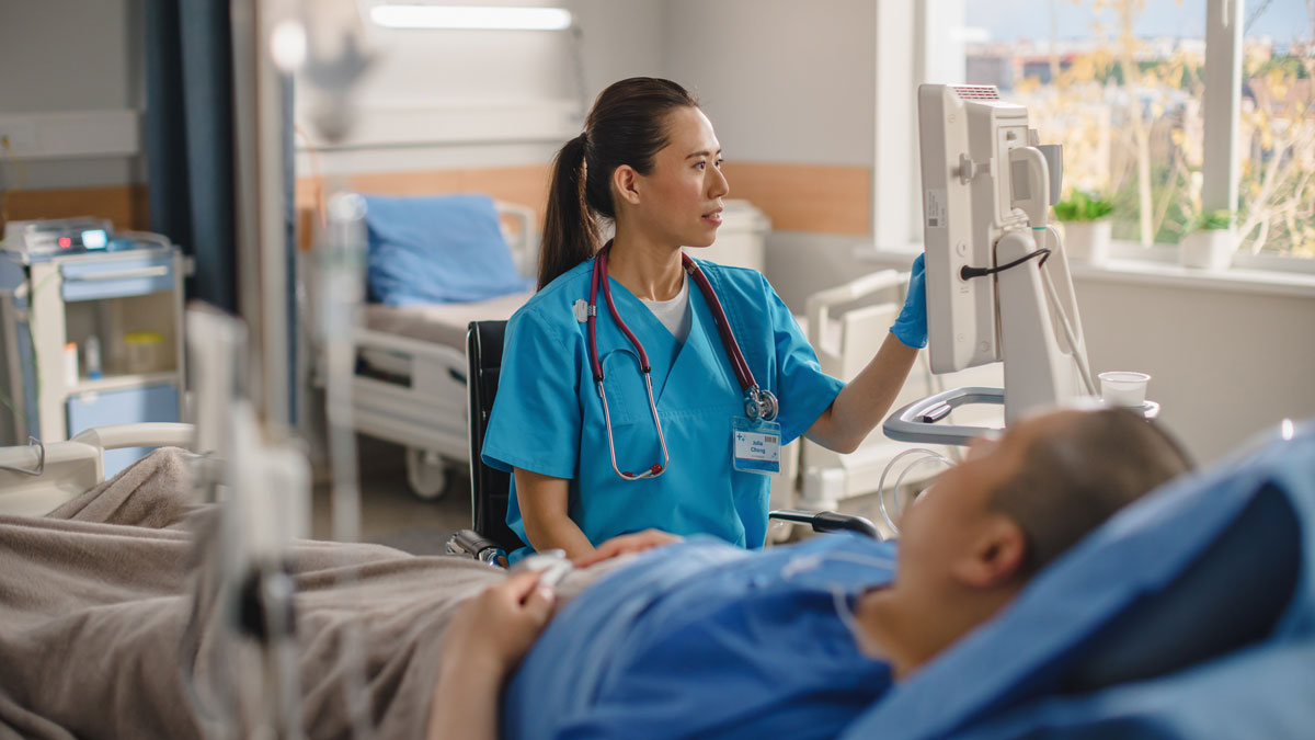 Nurse in hospital with patient.