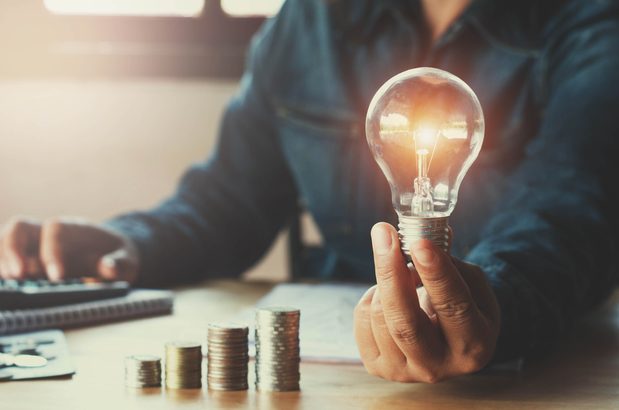 Coins leading to a lightbulb