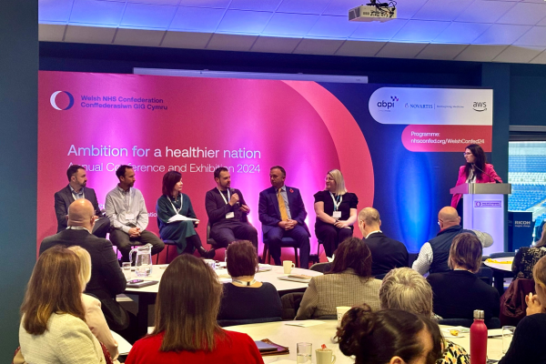 Panel discussion at the NHS confed with 6 speakers on stage