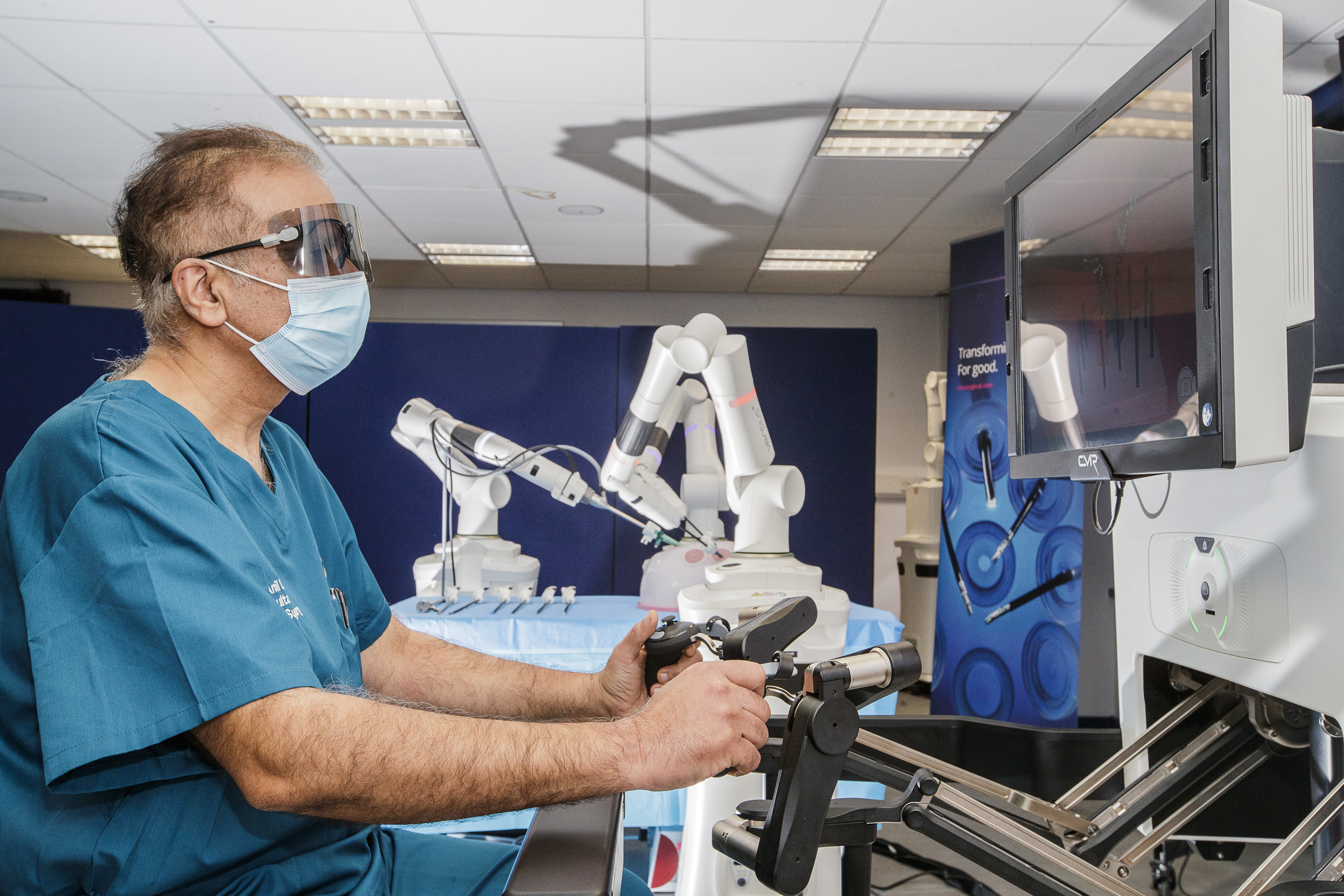 A surgeon using the Versius robotic surgery system