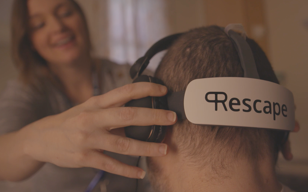 A person wearing a Rescape VR headset