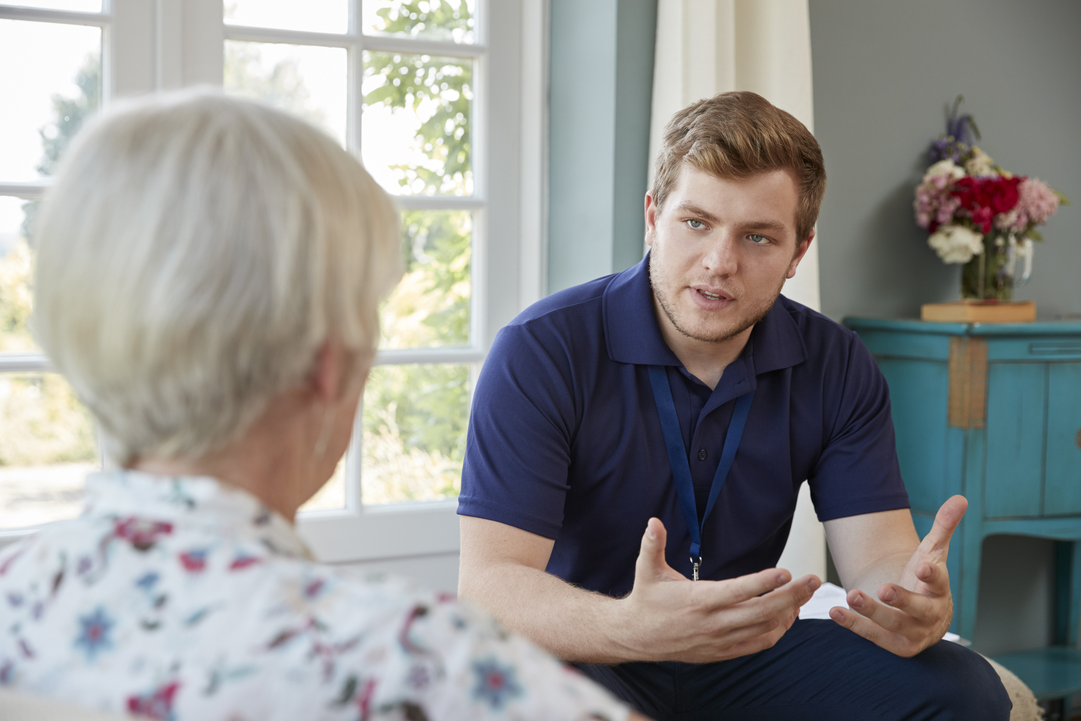 A medical expert visiting an elderly person at home