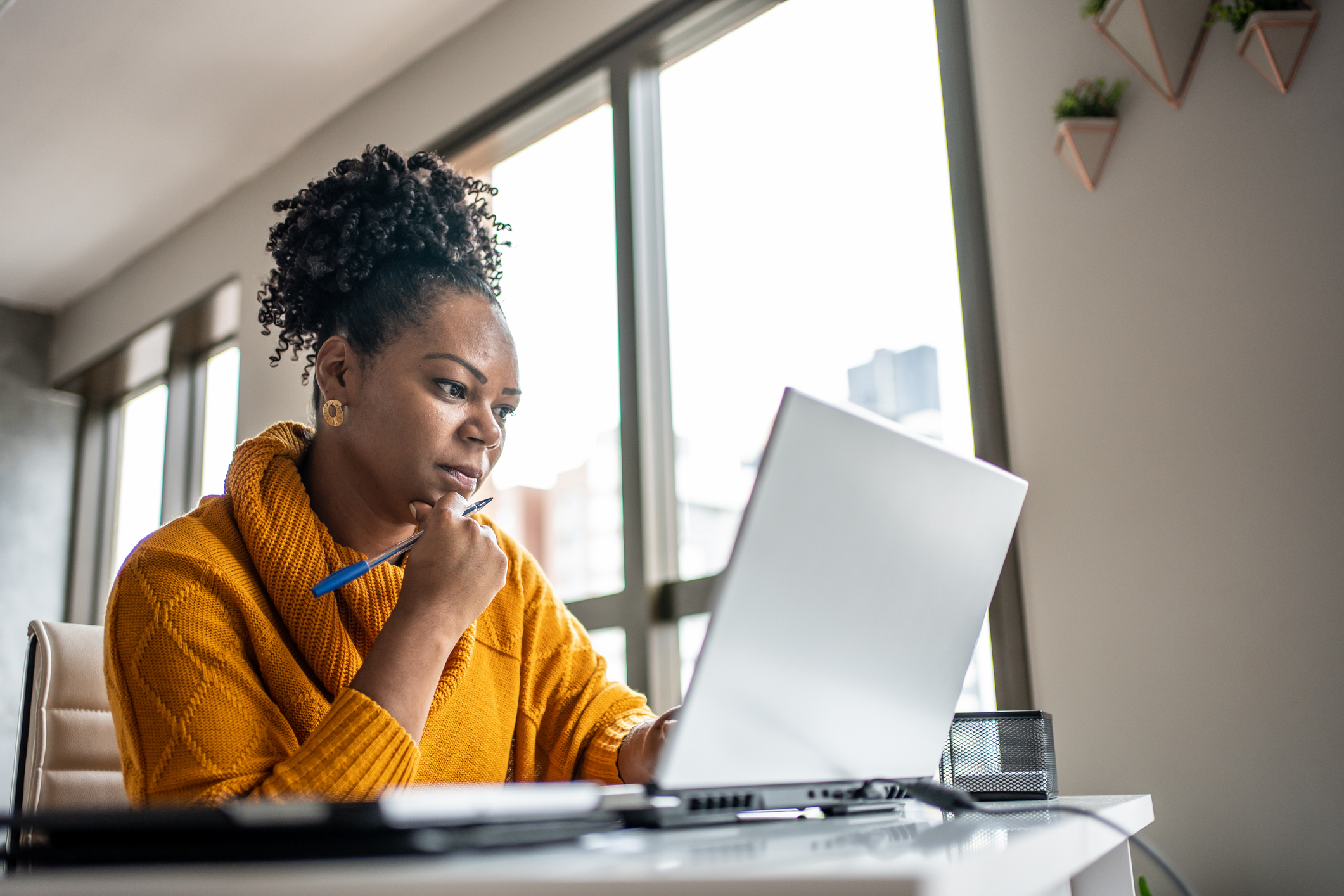 Woman sitting at a laptop