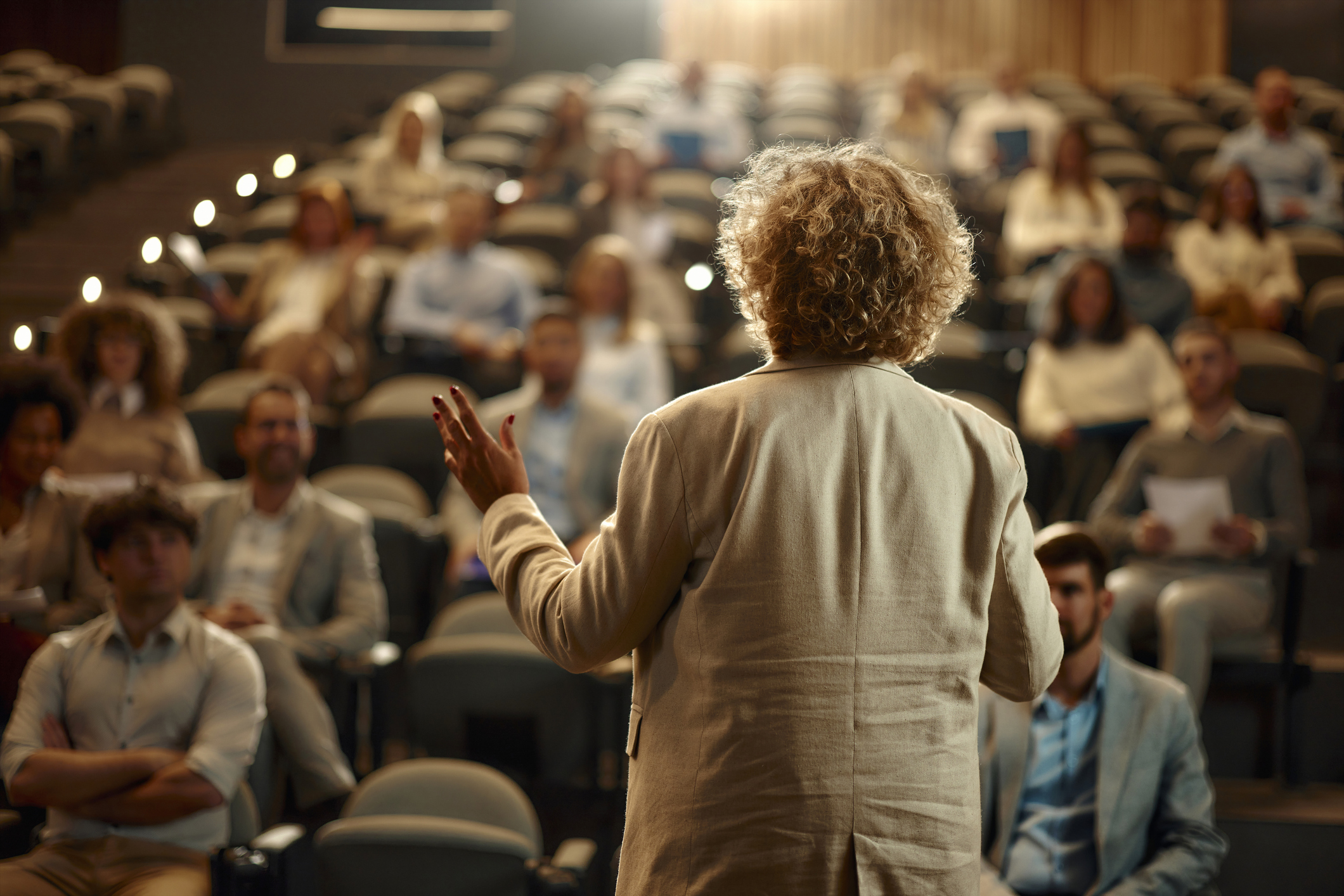 A woman speaking at a conference