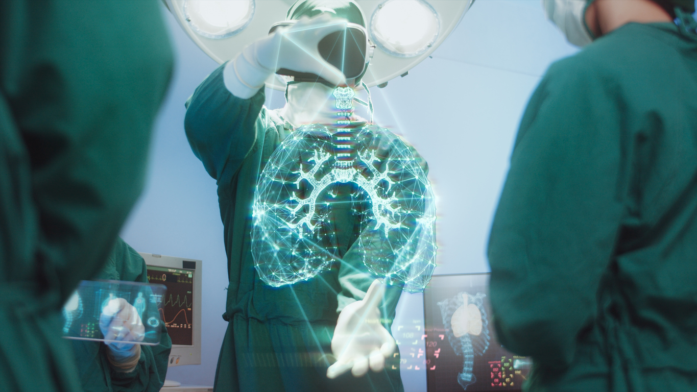 A surgeon next to a digital image of a lung