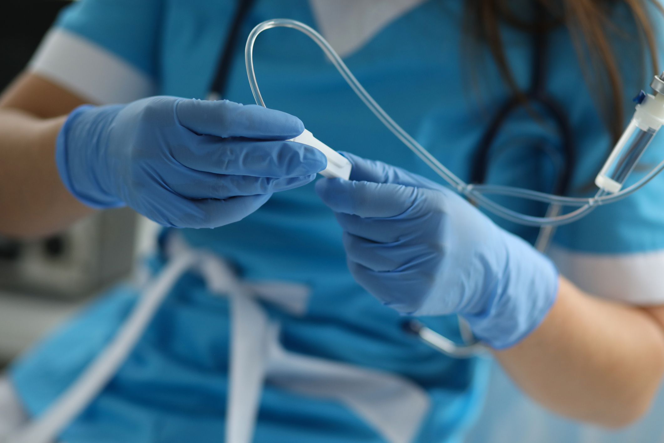 A medical expert administering an IV