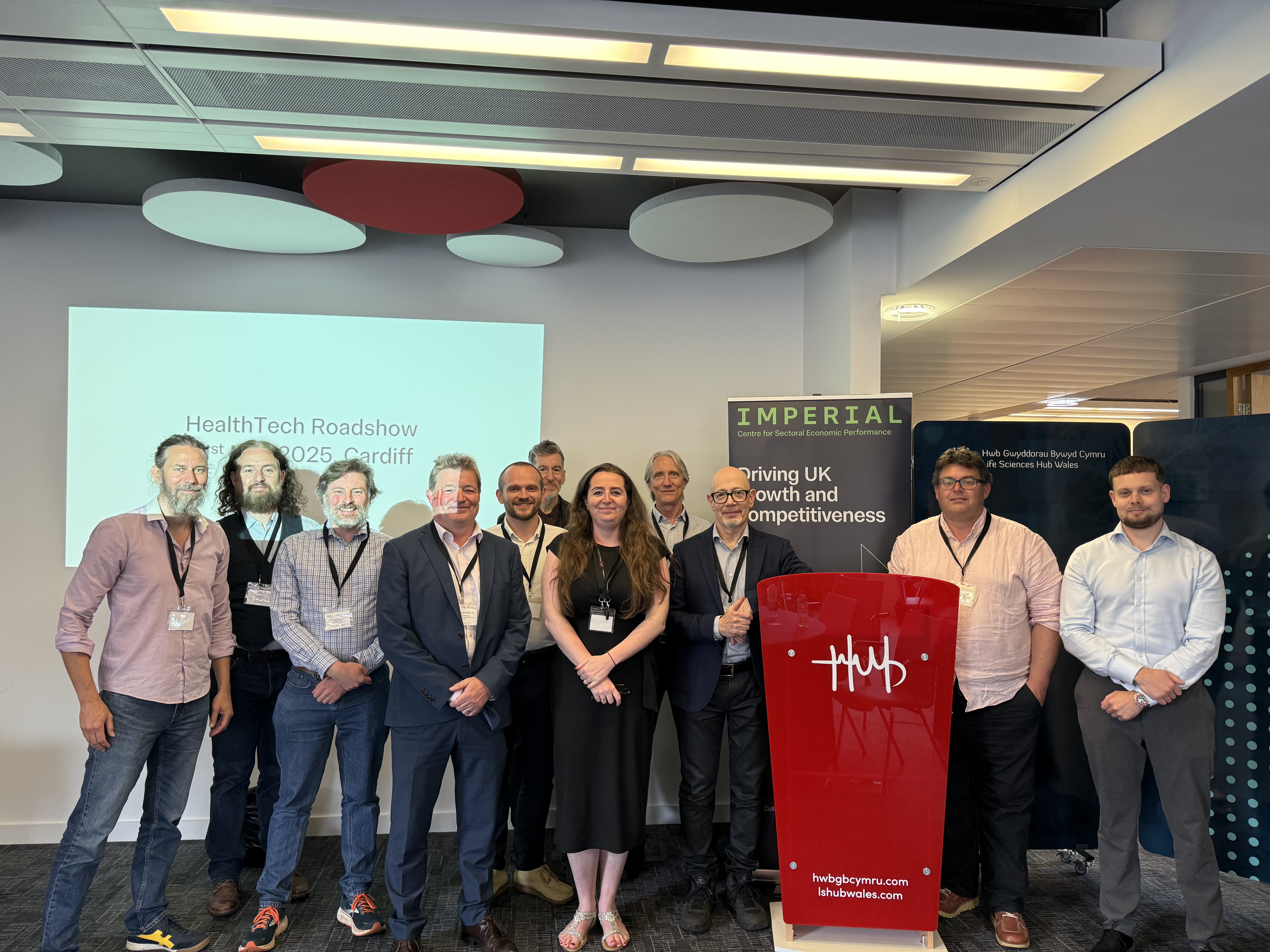 Attendees from the event standing and smiling