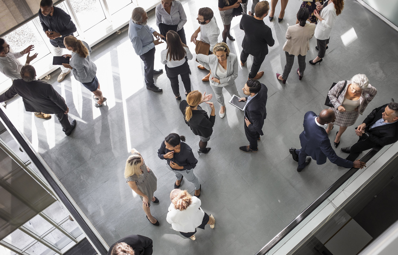 Birds-eye-view of group of people in atrium.