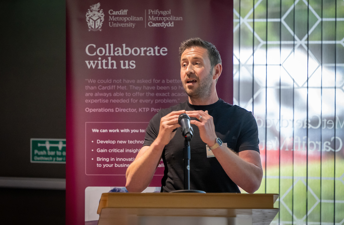 A speaker talking at an event at Cardiff Metropolitan University