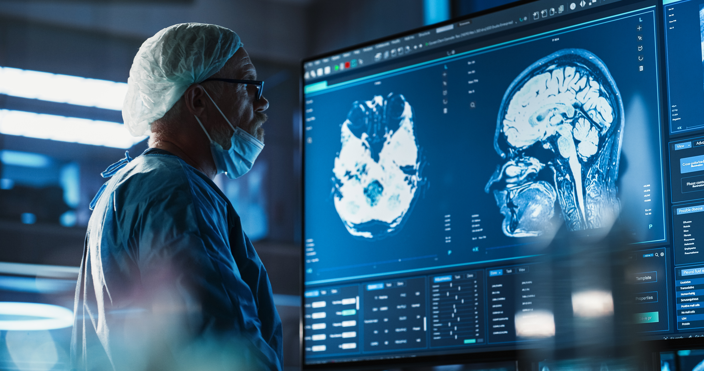 A surgeon looking at an MRI scan