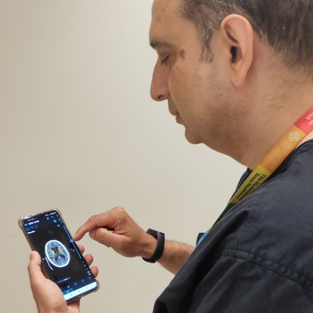 Blog author Dr Shakeel Ahmad using the Brainomix app