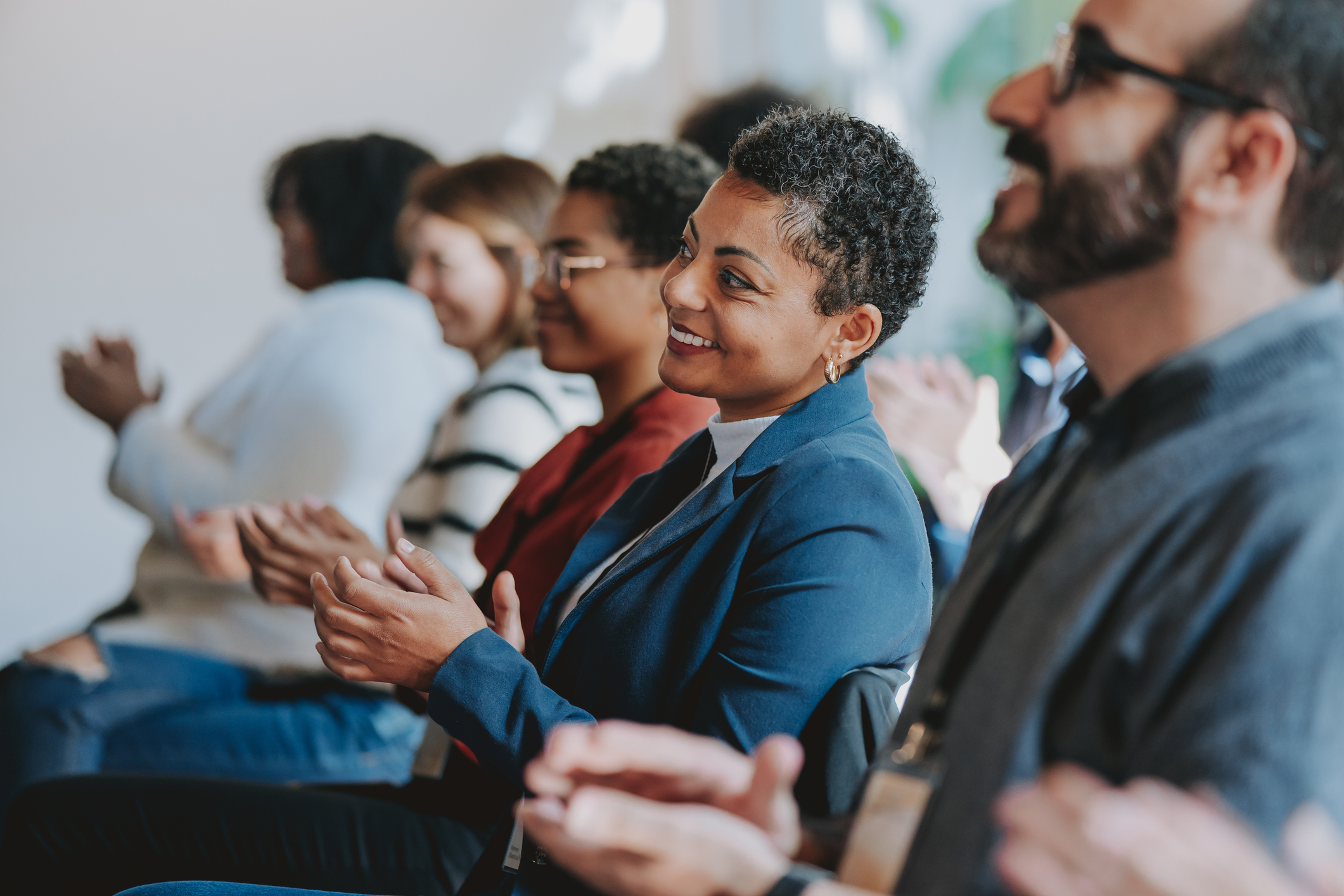 An audience applauding at a conference