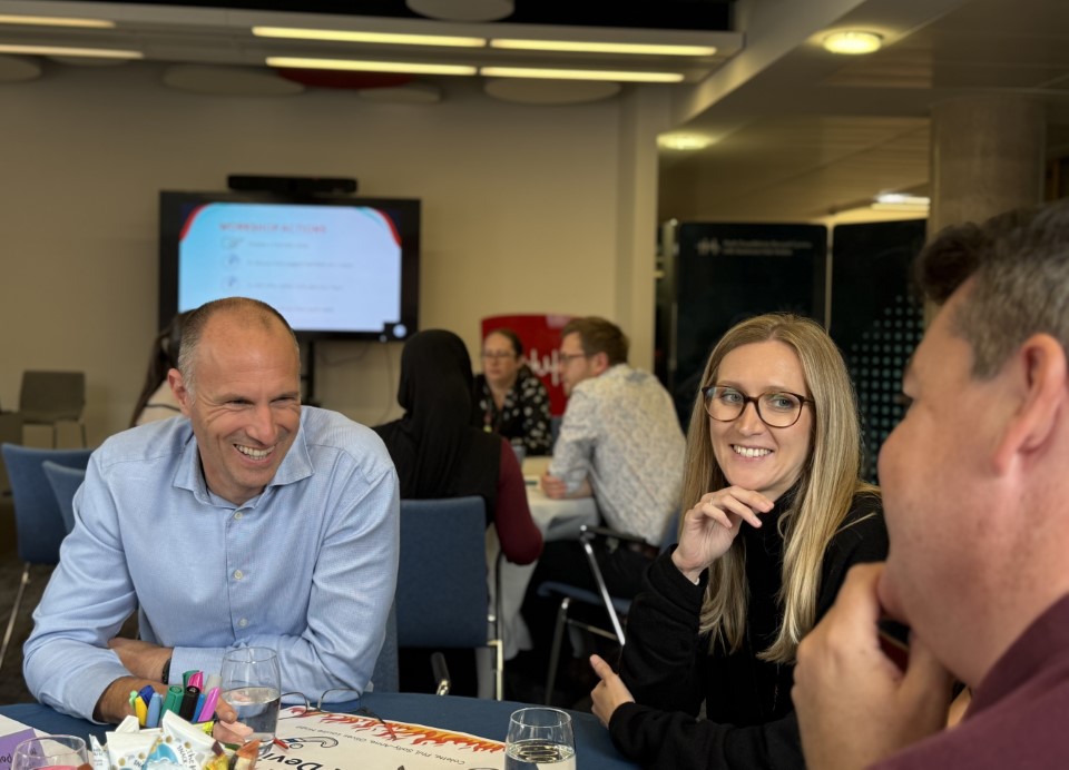 Gareth Healey and Louise Hogg talking at an event 