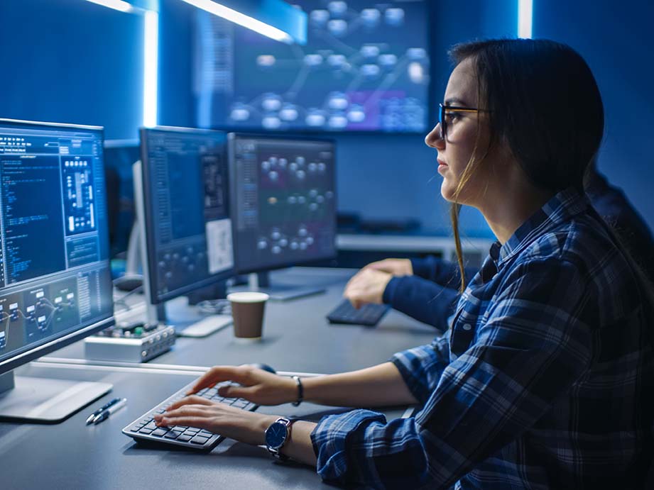 A woman looking at a laptop