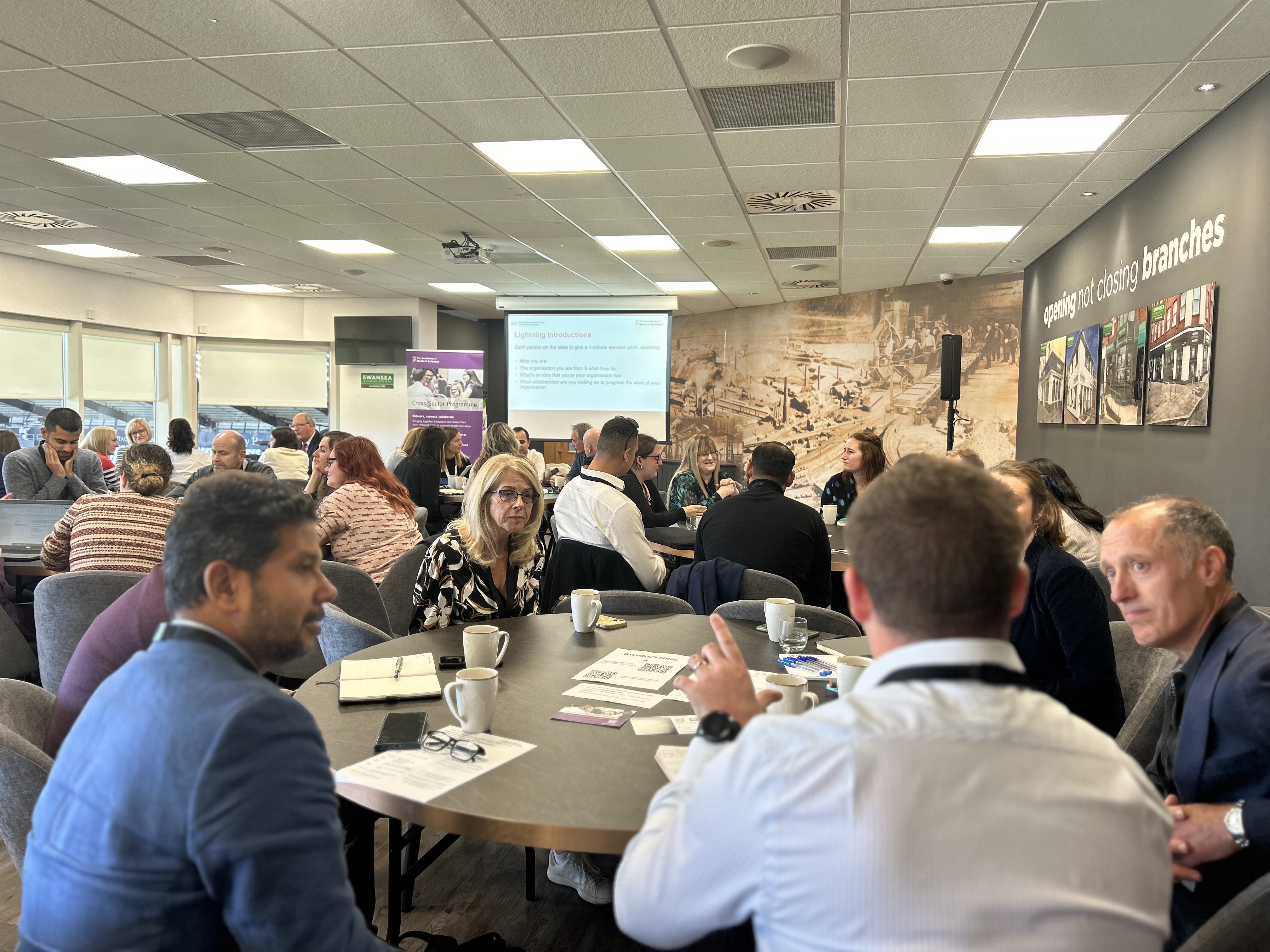 Room full of people at an event. 