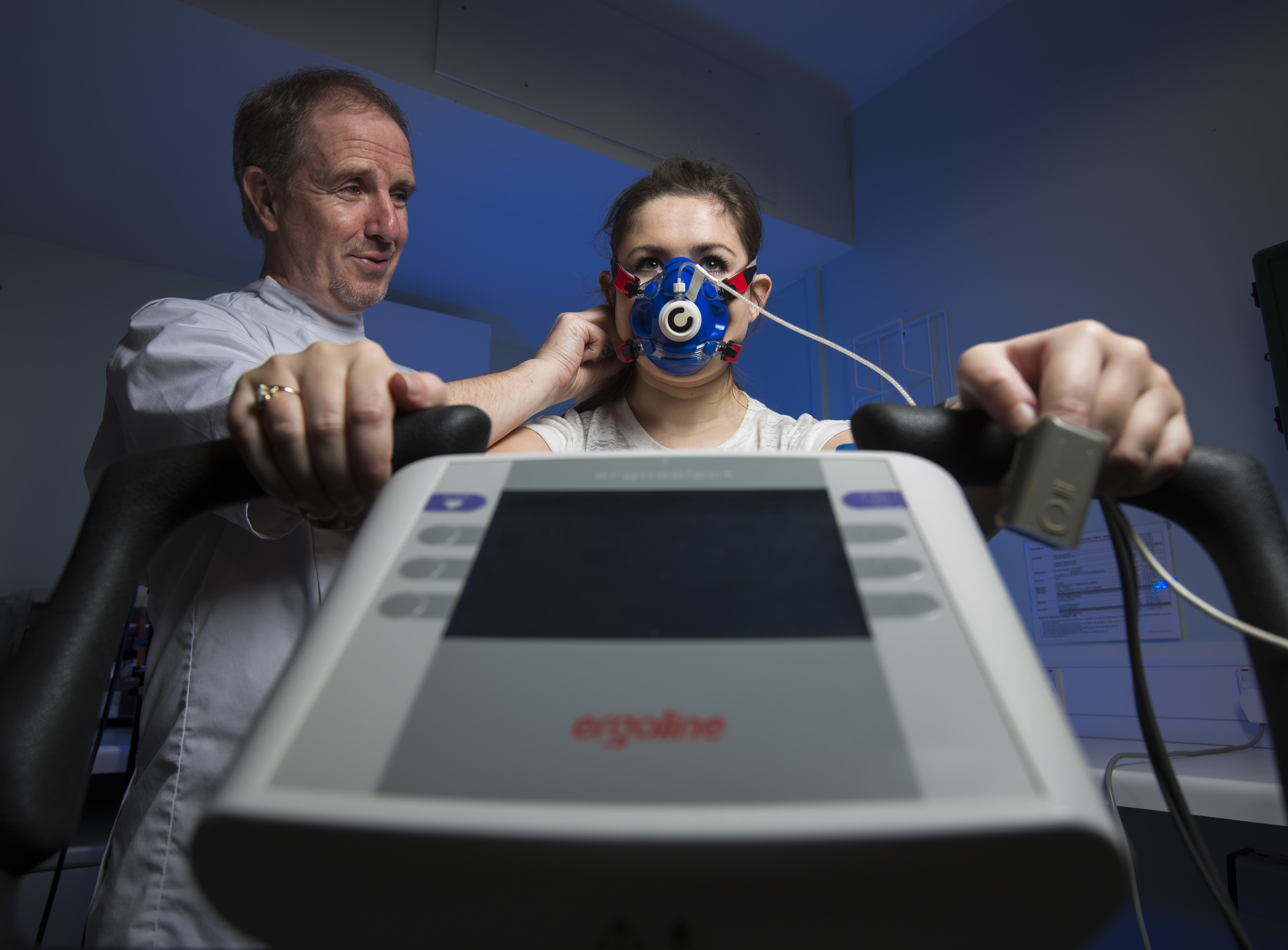 Woman using a respiratory machine. 
