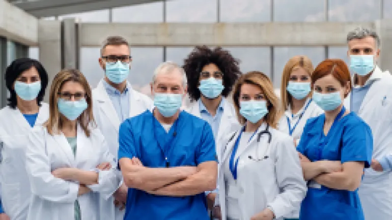 doctors looking at camera